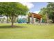 Scenic park featuring a pavilion, playground, picnic tables, and open green space for community enjoyment at 5104 E Liberty Park Cir, North Charleston, SC 29405