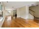 Spacious living room with hardwood floors, and staircase leading to upper level at 5104 E Liberty Park Cir, North Charleston, SC 29405