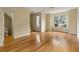 Open-concept living room with hardwood floors and a view to the front yard at 5104 E Liberty Park Cir, North Charleston, SC 29405