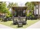 Charming outdoor stage with rocking chairs for seating, creating a cozy and inviting space at 5104 E Liberty Park Cir, North Charleston, SC 29405