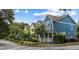 Street view of colorful homes, showcasing a vibrant neighborhood and sidewalk at 5104 E Liberty Park Cir, North Charleston, SC 29405