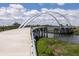 Modern pedestrian bridge with graceful arches, offering scenic views of the surrounding waterway at 5104 E Liberty Park Cir, North Charleston, SC 29405
