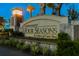Welcome to Four Seasons! Gorgeous community entrance sign with lush landscaping and a warm glow at 593 Marsh Cove Cir, Summerville, SC 29486