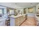Modern kitchen island featuring white cabinetry, granite countertop, and stainless steel dishwasher at 593 Marsh Cove Cir, Summerville, SC 29486