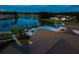 Aerial view showcases the pool and community with lake views and lush landscaping at 629 Marsh Cove Cir, Summerville, SC 29486