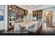Open-concept kitchen boasts a large island with bar seating and stylish pendant lighting at 629 Marsh Cove Cir, Summerville, SC 29486