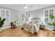 Comfortable bedroom with a ceiling fan, wood floors and bright natural light at 701 Hibbens Grant Blvd, Mount Pleasant, SC 29464