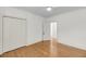 Inviting bedroom with a ceiling fan, hardwood flooring, closet, and an adjacent doorway leading to another room at 701 Hibbens Grant Blvd, Mount Pleasant, SC 29464