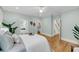 Bedroom view showcases wood floors, neutral walls, ensuite bath, and walk-in closet at 701 Hibbens Grant Blvd, Mount Pleasant, SC 29464