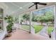 Spacious covered porch with chairs overlooking landscaped front yard at 701 Hibbens Grant Blvd, Mount Pleasant, SC 29464