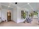 Charming porch featuring wood ceiling, comfortable seating and a beautiful entry door at 701 Hibbens Grant Blvd, Mount Pleasant, SC 29464