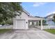 Detached garage with covered parking, a red roof, white siding, and a charming picket fence at 701 Hibbens Grant Blvd, Mount Pleasant, SC 29464