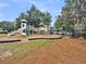 Community playground featuring modern play structures with slides and climbing areas next to the community pool at 701 Hibbens Grant Blvd, Mount Pleasant, SC 29464
