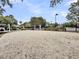 Community sand volleyball court with lush landscaping and neighborhood homes in the background at 701 Hibbens Grant Blvd, Mount Pleasant, SC 29464
