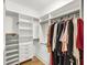 Walk-in closet features built-in shelves and hanging rods for clothing storage at 701 Hibbens Grant Blvd, Mount Pleasant, SC 29464