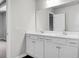 Bathroom featuring a white double vanity with a large mirror and modern fixtures at 717 Butter Rd, Bonneau, SC 29431