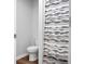 Bathroom featuring toilet with wood look floor and shower with decorative curtain at 717 Butter Rd, Bonneau, SC 29431