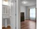 Bedroom showing off wood floors, bathroom doorway and large window at 717 Butter Rd, Bonneau, SC 29431