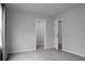 This bedroom offers neutral walls and carpet, along with an ensuite and closet at 717 Butter Rd, Bonneau, SC 29431