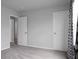 This bedroom offers neutral walls and carpet, along with an ensuite and closet at 717 Butter Rd, Bonneau, SC 29431