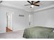 Bright bedroom featuring neutral tones, carpet floors, and a ceiling fan at 717 Butter Rd, Bonneau, SC 29431