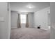 An expansive bonus room with neutral walls and carpet, filled with natural light at 717 Butter Rd, Bonneau, SC 29431