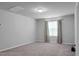 A spacious bonus room with neutral walls and carpet, featuring ample light at 717 Butter Rd, Bonneau, SC 29431