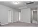 The bonus room with neutral walls and carpet connects the upstairs area at 717 Butter Rd, Bonneau, SC 29431