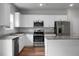 Bright kitchen with stainless steel appliances, granite countertops, and an island at 717 Butter Rd, Bonneau, SC 29431
