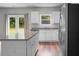 Contemporary kitchen featuring white cabinets, granite countertops, and stainless appliances at 717 Butter Rd, Bonneau, SC 29431