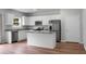 Modern kitchen featuring white cabinets, stainless steel appliances, and granite countertops at 717 Butter Rd, Bonneau, SC 29431