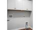 Laundry room with white cabinets and hookups for a washer and dryer at 717 Butter Rd, Bonneau, SC 29431