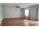 Inviting living room with hardwood floors, fan, and neutral colors at 717 Butter Rd, Bonneau, SC 29431