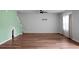 Spacious living room with hardwood floors, fan, and natural light at 717 Butter Rd, Bonneau, SC 29431