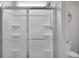 All white shower stall with sliding doors and built-in shelving at 717 Butter Rd, Bonneau, SC 29431