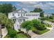 Stunning aerial view of a beautifully landscaped property featuring a two-story home with lush greenery and mature trees at 732 Gate Post Dr, Mount Pleasant, SC 29464