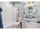 Charming bathroom with fish wallpaper, white subway tile shower, and white marble vanity at 732 Gate Post Dr, Mount Pleasant, SC 29464