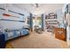 Bright bedroom with blue walls, hardwood floors, and nautical decor at 732 Gate Post Dr, Mount Pleasant, SC 29464
