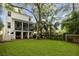 Spacious backyard with a screened porch, an outdoor dining space, and ample green space at 732 Gate Post Dr, Mount Pleasant, SC 29464