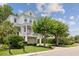 Charming two-story home featuring a welcoming front porch, well-maintained landscaping, and a convenient two-car garage at 732 Gate Post Dr, Mount Pleasant, SC 29464