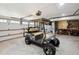 Well-lit garage featuring a golf cart at 732 Gate Post Dr, Mount Pleasant, SC 29464