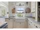 Cozy kitchen features a farmhouse sink, open shelving, and ample counter space at 732 Gate Post Dr, Mount Pleasant, SC 29464
