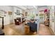 Spacious living room filled with natural light, featuring hardwood floors, a fireplace, and comfortable seating arrangement at 732 Gate Post Dr, Mount Pleasant, SC 29464