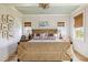 Bright main bedroom featuring woven bed frame, hardwood floors and scenic outdoor views at 732 Gate Post Dr, Mount Pleasant, SC 29464