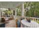 Relaxing covered porch with comfortable seating and views of the surrounding greenery at 732 Gate Post Dr, Mount Pleasant, SC 29464