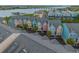 Aerial view of colorful townhomes, offering picturesque waterfront views and convenient parking at 81 Sandbar Ln # 23, Folly Beach, SC 29439