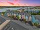 Aerial view of colorful townhomes, offering picturesque waterfront views and convenient parking at 81 Sandbar Ln # 23, Folly Beach, SC 29439