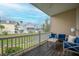 Relaxing balcony with blue patio furniture and views of the surrounding beach community at 81 Sandbar Ln # 23, Folly Beach, SC 29439