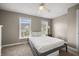 Bedroom featuring carpet floors, two windows, ceiling fan and a light colored bed at 81 Sandbar Ln # 23, Folly Beach, SC 29439
