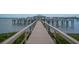 Wooden walkway on the dock with boat slips and water views, showing a tranquil harbor at 81 Sandbar Ln # 23, Folly Beach, SC 29439